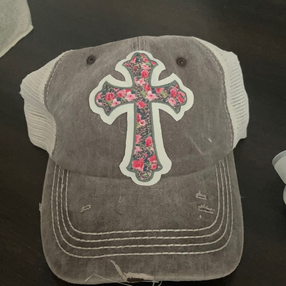 Hat with a floral cross